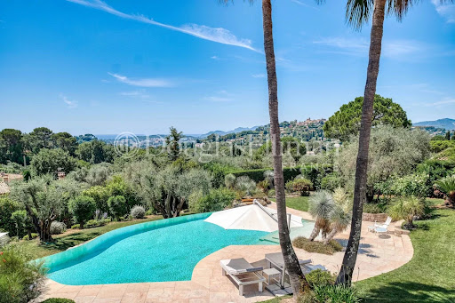 Pool with view of green hills in this luxury villa for sale in Mougins ($6,025,675 - 385 m²)