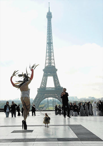 Steven Cohen appears at the Eiffel Tower in Paris with a cockerel tied to his penis. He says he carried on 'until they absolutely forced me to stop.'