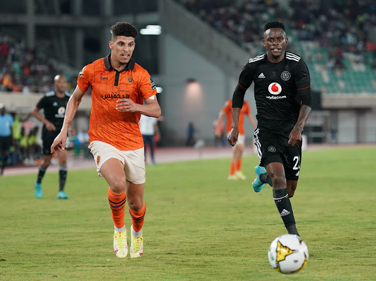 Youssef Elfahli of RS Berkane and Innocent Maela of Orlando Pirates challenge for the ball during their CAF Confederation Cup final at the Godswill Akpabio International Stadium in Uyo, Nigeria.