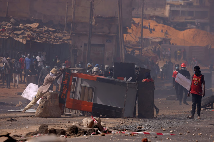 Supporters of Senegal opposition leader Ousmane Sonko prepare barricades as they clash with security forces, after Sonko was sentenced to prison in Dakar, Senegal, on June 2 2023.