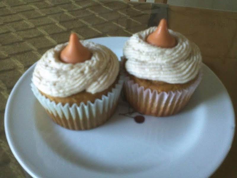 Pumpkin Spice Muffins With Spiced Marshmallow Filling, Topped With Maple Frosting And A Hershey Pumpkin Spice Kiss.