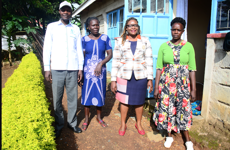 Secretary General of Civil Societies in Migori County Titus Orwa and the widows in Migori