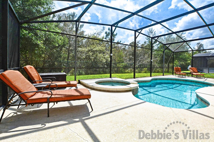 South-facing pool deck with conservation view at this Kissimmee villa