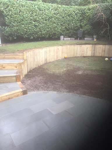 Smooth sandstone with steps and sleeper wall 