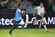 Canan Moodie of the Bulls lengthens his stride against Saracens in Saturday's Investec Champions Cup match at Loftus Versfeld. Here he is chased by Alex Goode.