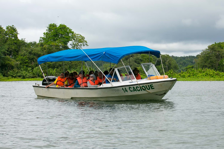  A tour boat plies an inlet off Gatun Lake in Panama. 