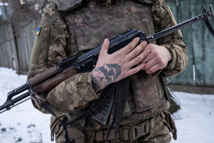 A Ukrainian serviceman of the 80th Air Assault Brigade holds a rifle, amid Russia's attack on Ukraine, near Bahmut, Donetsk region, Ukraine, February 16, 2023.