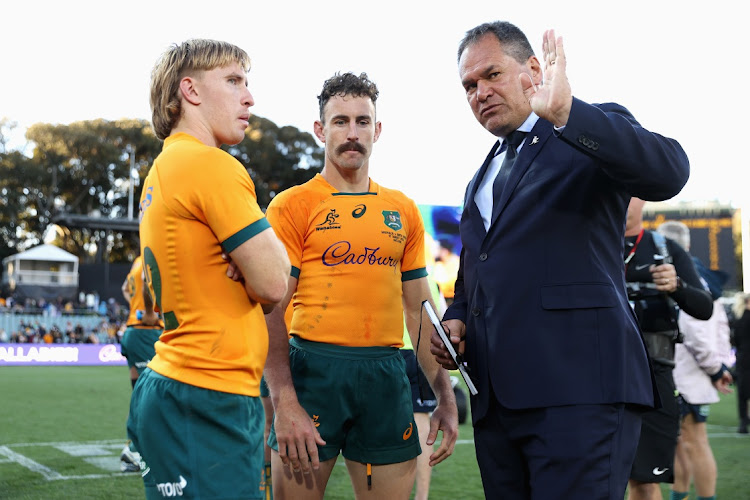 Wallabies head coach Dave Rennie talks to Tate McDermott of the Wallabies and Nic White of the Wallabies after winning The Rugby Championship match against the Springboks at Adelaide Oval on August 27 2022 in Australia. Picture: GETTY IMAGES/CAMERON SPENCER