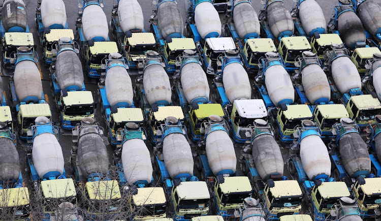 Concrete mixer trucks are parked at a factory due to a strike by a truckers’ union in Anyang, South Korea, on November 28 2022. Picture: YONHAP NEWS AGENCY VIA REUTERS