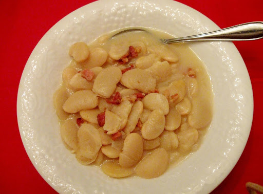 A bowl of Butter Beans with a slice of corn bread and dinner is served !