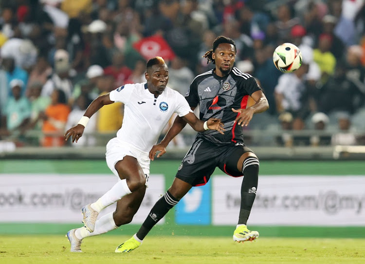 Orlando Pirates defender Olisa Ndah in a tussle for the ball with Khuda Myaba of Richards Bay during their DStv Premiership at the Orlando Stadium.