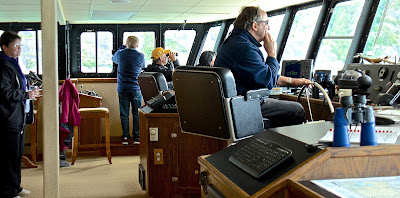 Passengers on the bridge of Safari Explorer during an Un-Cruise Adventures sailing to Alaska.