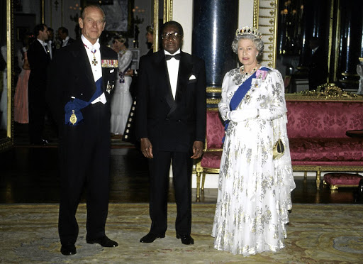 Robert Mugabe at a function with Queen Elizabeth II and Prince Philip in May 1994.