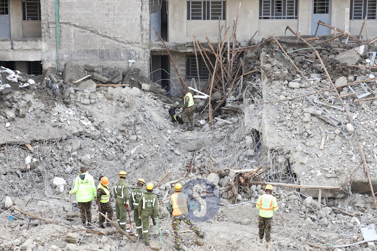 A police dog searches for clues on presence of victims of seven-storey building that collapsed at Kasarani, Nairobi on November 16, 2022.