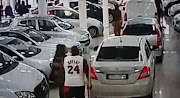 An angry customer smashed in a car window at a dealership.