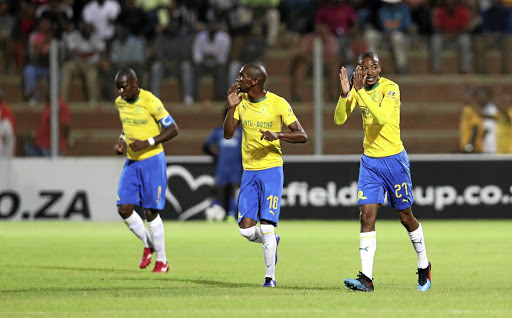 Thapelo Morena, right, celebrates with Sundowns teammates Anele Ngcongca and Hlompho Kekana on Tuesday.