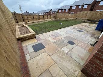 Indian Sandstone patio with sleeper, edging and raised planters Burnley album cover