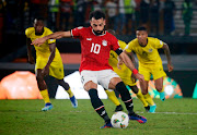 Egypt's Mohamed Salah scores their second goal from the penalty spot.