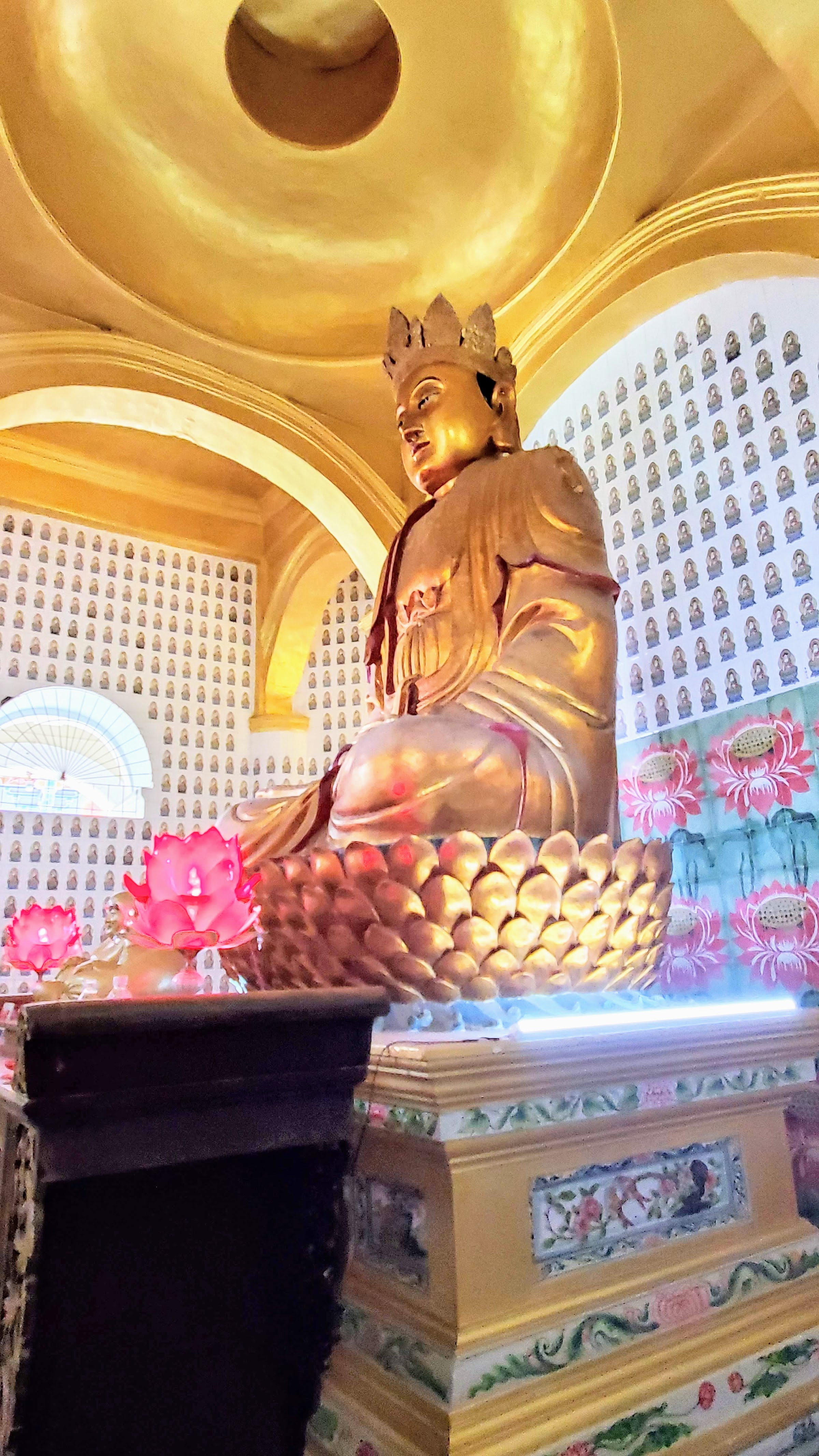 Visiting Kek Lok Si: What makes it unique is that among its millions of Buddhas it shows the blending of cultures that is so representative of Malaysia by including many stylistic representations of Buddha.