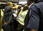 Members of the security scuffle with members of the ANC during the State of the Capital Address, at the Pretoria Show grounds. Members of the Police and Metro Police were called in after ANC councillors repeatedly disrupted formal proceedings.