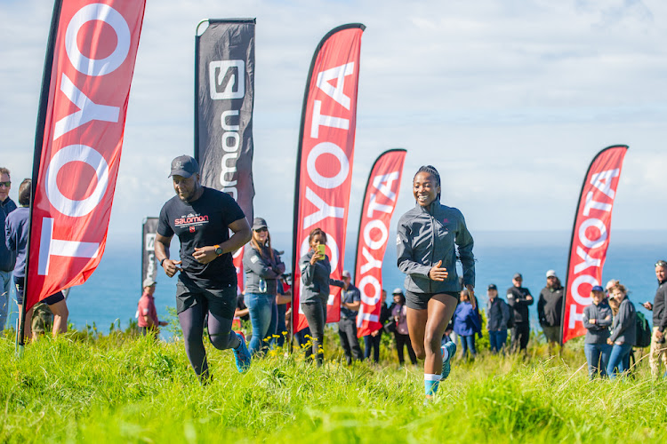 Jacob Maboja and partner, fitness celebrity Nkateko ‘Takkies’ Dinwiddy, sprint out of the blocks for their trail-run atop a mountain.