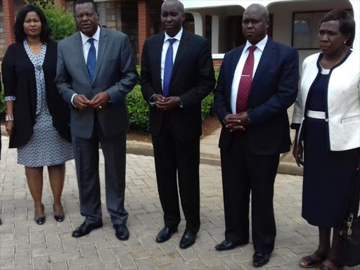 KMTC chairman Philip Kaloki, Kajiado governor Joseph Lenku and other officials after a meeting in the county on July 31, 2018. /KURGAT MARINDANY