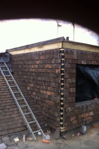 New roof work using reclaimed tiles album cover