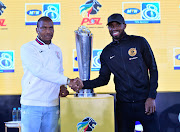 Kaizer Chiefs defender Ramahlwe Mphahlele (R) shakes hands with Free State Stars' Nedbank Cup winning captain Paulus Masehe (L) during the MTN8 launch at Johannesburg Park Station, Johannesburg on July 30 2018.