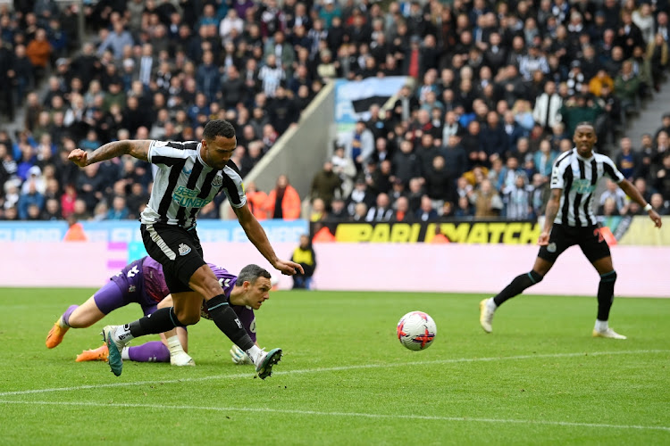 Callum Wilson of Newcastle United takes the ball around Alex McCarthy of Southampton and scores the team's third goal at St. James Park in Newcastle upon Tyne, England, April 30 2023. Picture: STU FORSTER/GETTY IMAGES