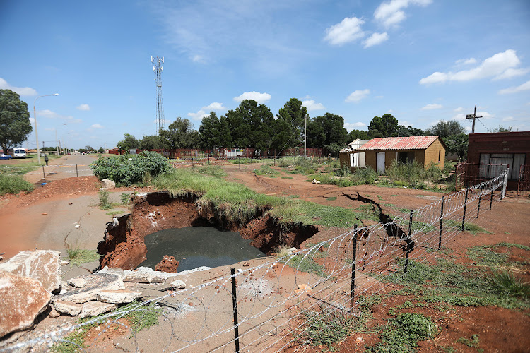 One of the sinkholes in Khutsong is dangerously close to homes. File photo.