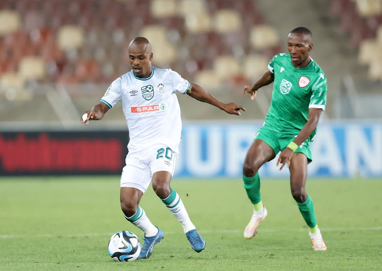 AmaZulu midfielder Celimpilo Ngema is challenged by Elias Mokwana of Sekhukhune United during their Nedbank Cup last 16 match at Peter Mokaba Stadium.