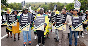 ANC members demonstrate outside the ANC special national executive committee meeting at Nasrec  in Johannesburg in support of President Cyril Ramaphosa in his Phala Phala case.