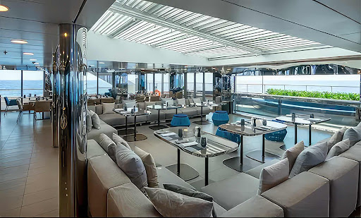 lounge-1.jpg - Take in the passing sights in the top-level lounge aboard Scenic Eclipse II.