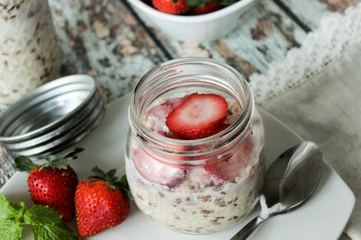 Strawberry overnight oats in a mason jar.