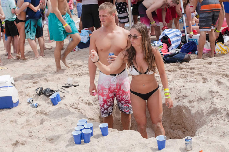 Amy and Taylor playing beer pong during spring break.