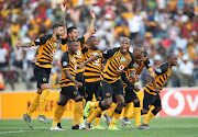 Kaizer Chiefs players celebrate after winning a penalty shootout.