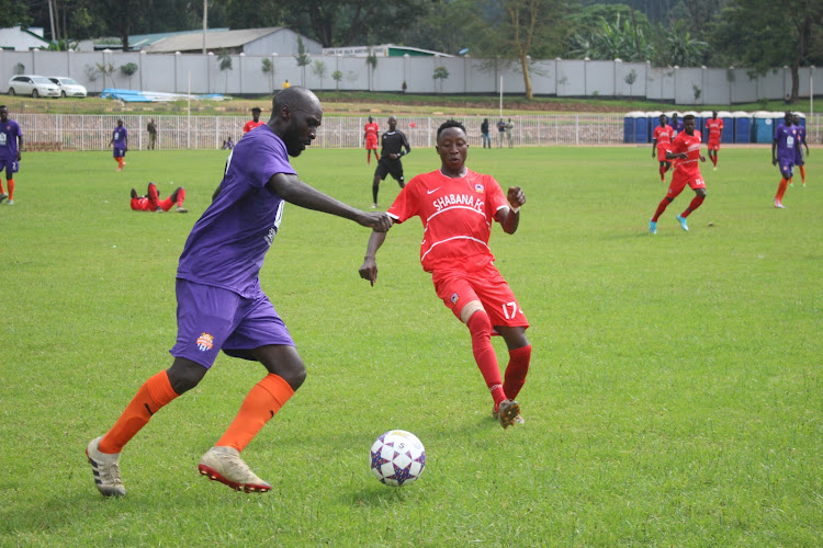 Wycliffe Otieno of Nairobi City Stars (L) battles for the ball with Shabana's Coulibally Mohammed during an NSL game at Gusii Stadium