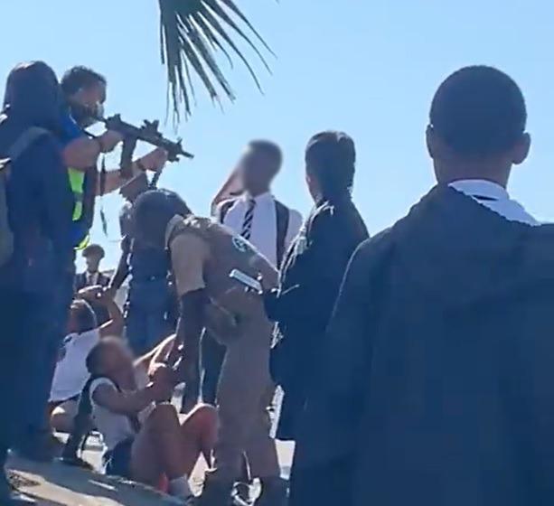 A screenshot from a video clip online shows an alleged security officer pointing a firearm in the face of a school pupil outside Effingham Secondary School in Durban.