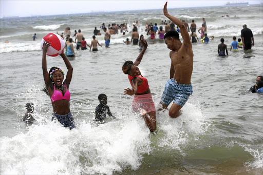 Friends Khatiwe Dladla, Sipho Chere and Pretty Ngcamu on Umhlanga beach in December.