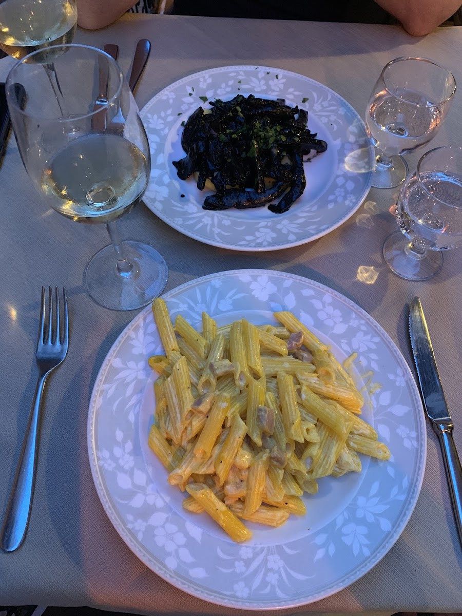 GF penne alla carbonara and squid ink cuddle fish with polenta.