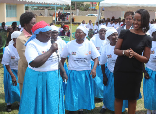 Machakos first lady Lilian Nganga (r) dance with women in Machakos town to commemorate Fistula day.Photo/Wambua Kavila