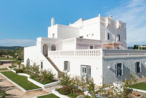 Wonderful facade of white Masseria San Giovanni in Puglia, Italy