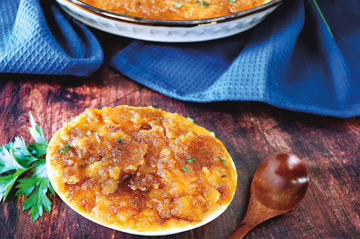 A small bowl of Streusel Yam Casserole.