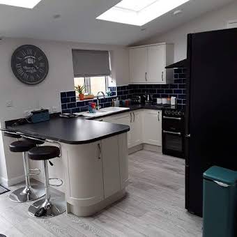 Fitted kitchen with laminate flooring throughout ground floor album cover