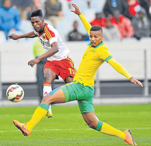 TRICKY SITUATION: Ary Papel of Angola and Bafana’s Rivaldo Coetzee will face off again at Moses Mabhida Stadium tonight Picture: GALLO IMAGES