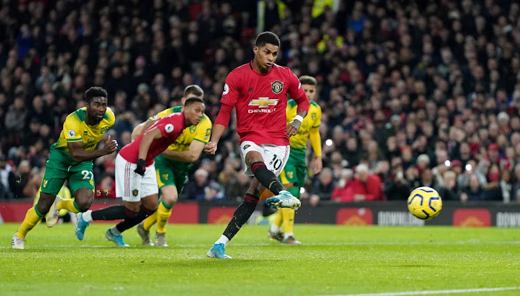 United's Marcus Rashford scopres from the penalty spot against Norwich