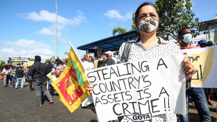 A Sri Lankan woman protests against the country's leadership.