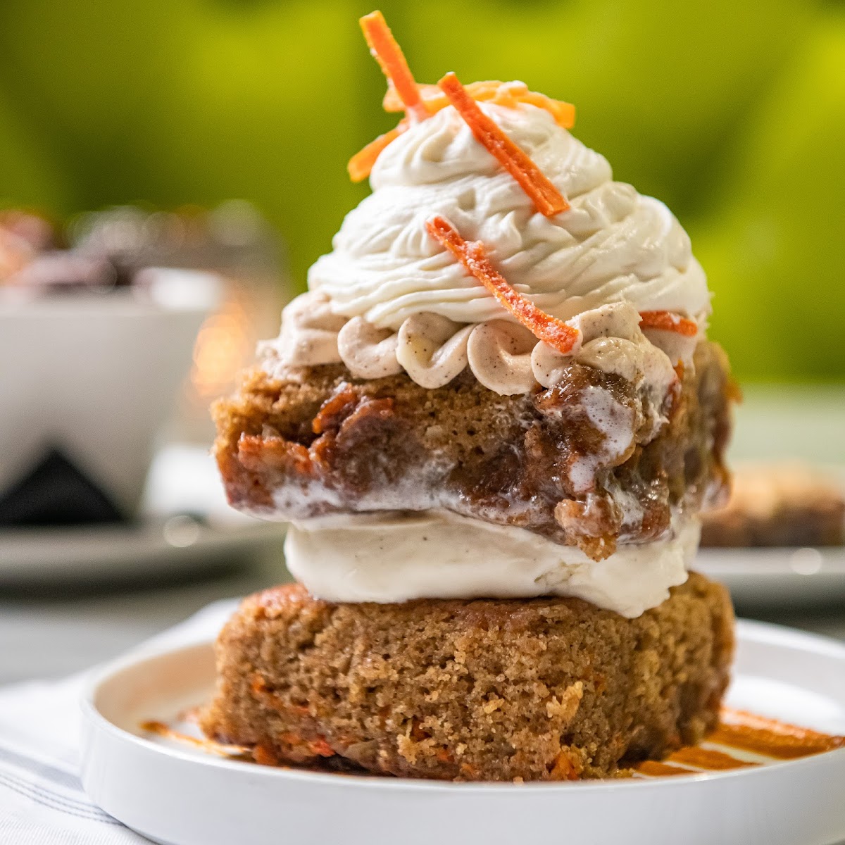 carrot cake | our ooey, gooey & buttermilk-glazed, super moist cake |
whipped cream cheese frosting | vanilla bean ice cream |
creamy carrot coulis | fresh whipped cream |
candied carrots