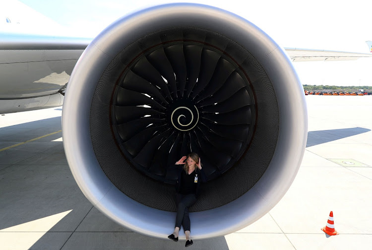 PR agent Elsa Goette sits in a Rolls-Royce engine of an Airbus A350-900 of Ethiopian Airlines during a site-inspection at Fraport airport in Frankfurt, Germany, in this May 22 2017 file photo. Picture: REUTERS/KAI PFAFFENBACH