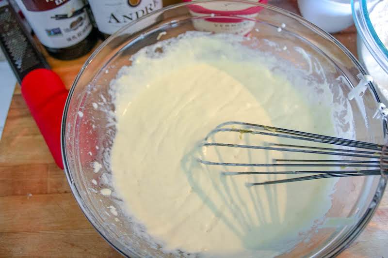 Eggs, Crème Fraiche, Butter, And Vanilla Combined In A Bowl.